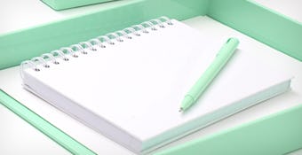 mint pen, white spiral notepad, and mint tray